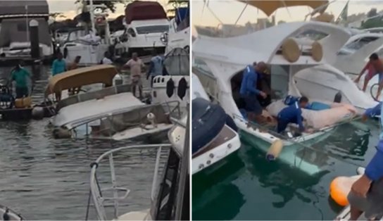 Lancha é retirada de píer após quase afundar na Bahia Marina; veja vídeo